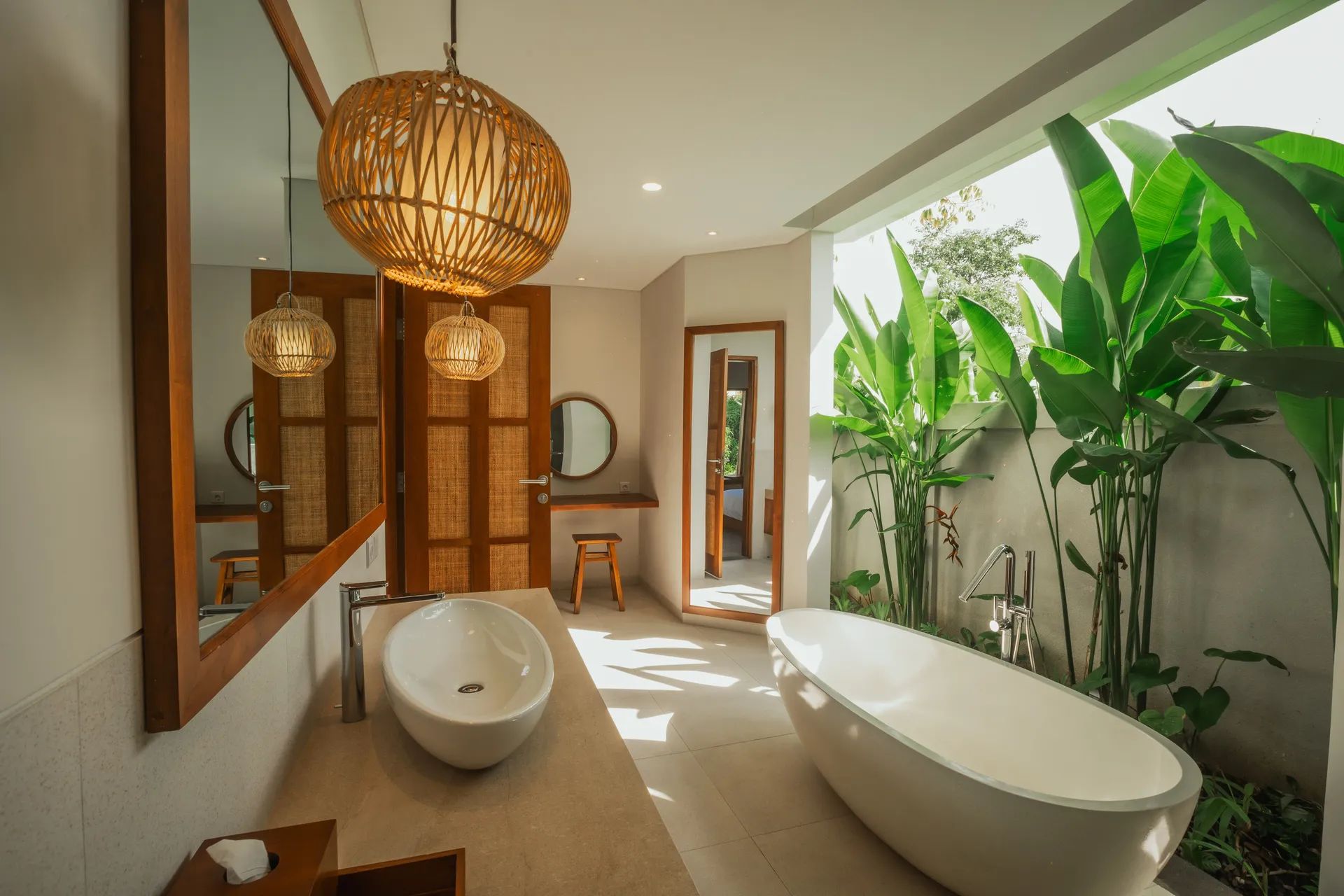 Bathroom with tub and rattan pendant