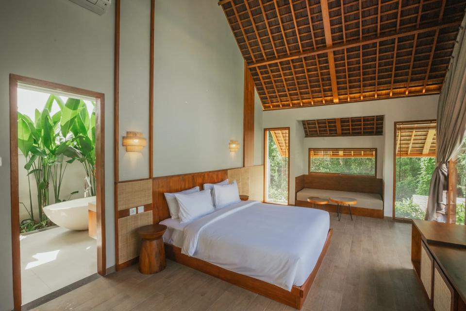 Bedroom under a pitched timber roof